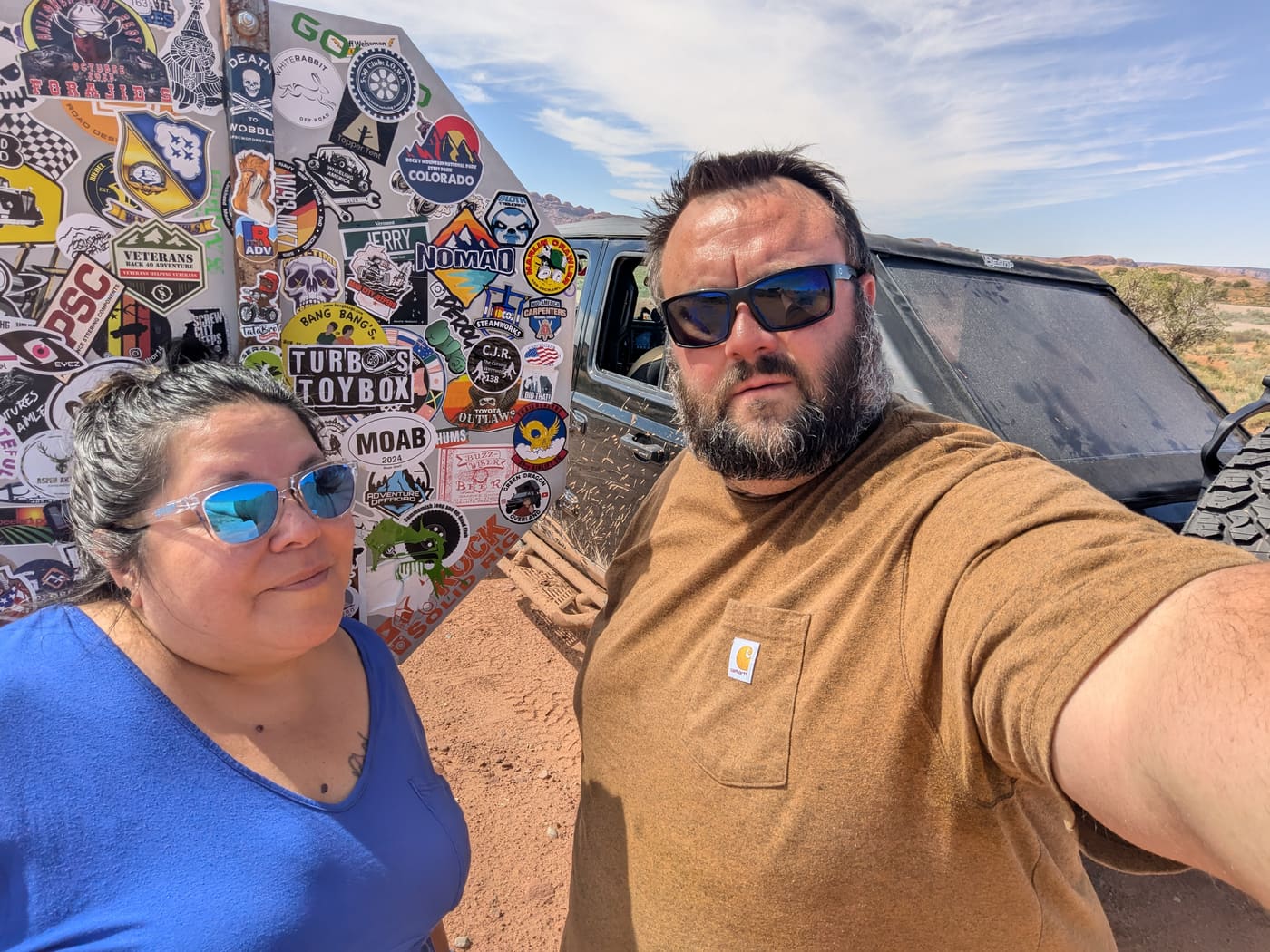 Dan and Drea at the Moab sticker wall